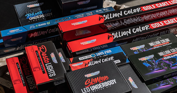 LEDGlow lighting kits, apparel, and accessories laid out for a sponsored build